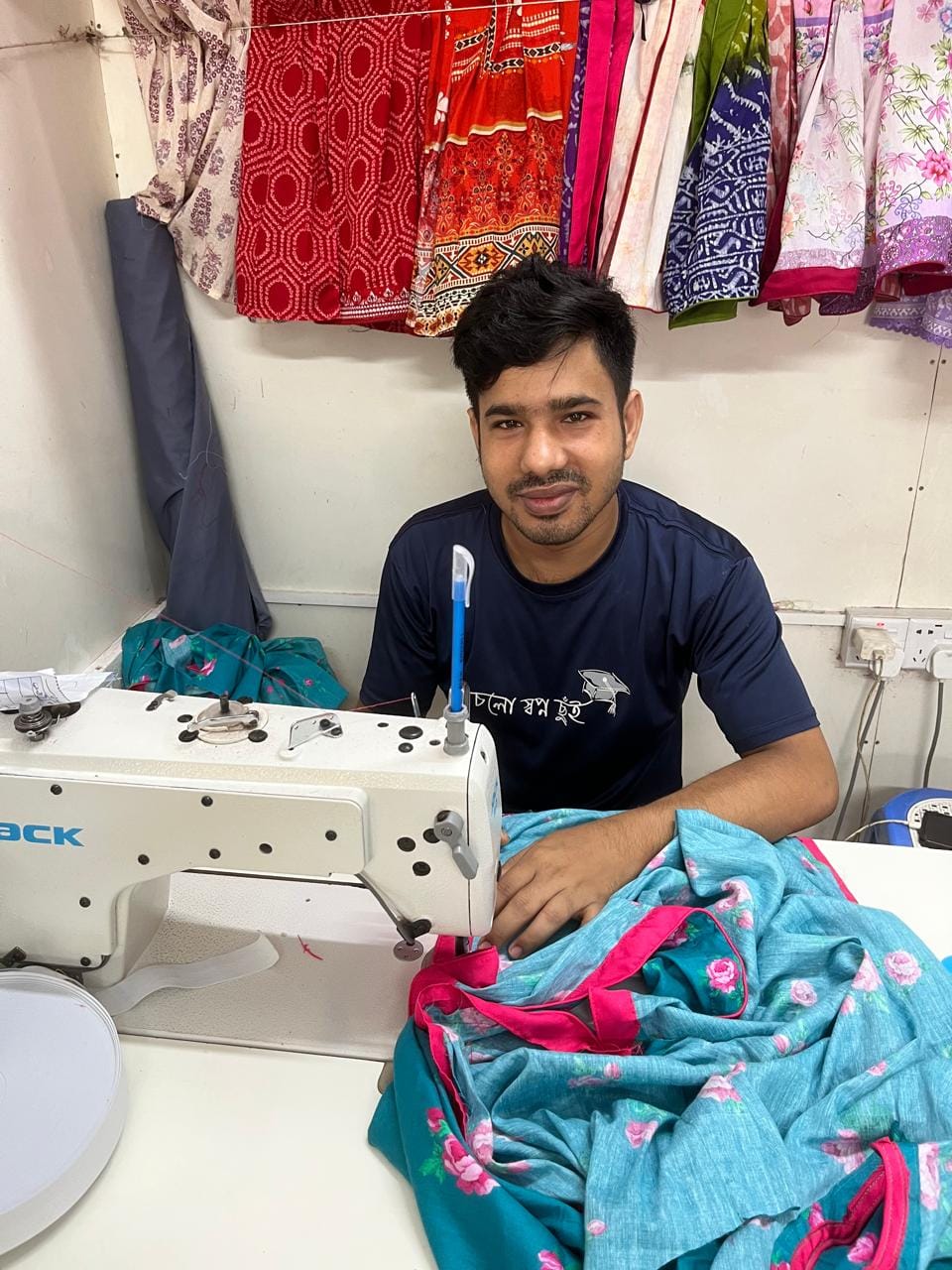 Master Tailor Tarek operating a Jack industrial lockstitch machine at Simon Morsh Boutique House factory